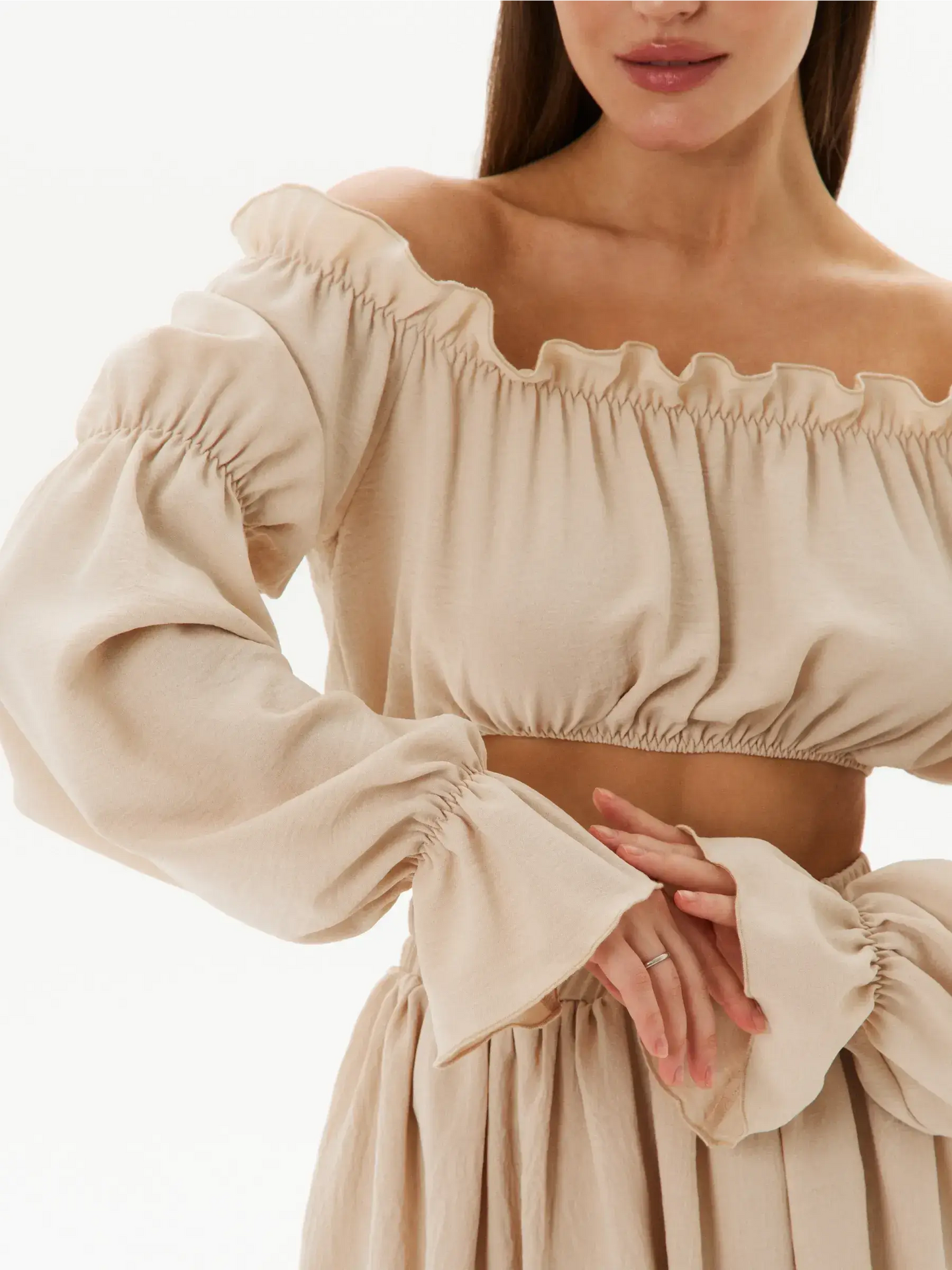 Off-shoulder crop top with ruffle details in lightweight fabric, part of Ruffle Breeze Set for summer elegance.