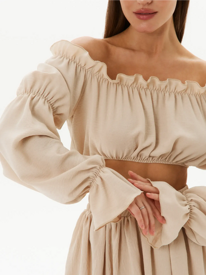 Off-shoulder crop top with ruffle details in lightweight fabric, part of Ruffle Breeze Set for summer elegance.