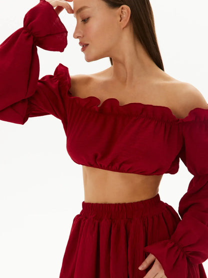 Ruffle Summer Set featuring an off-shoulder crop top and tiered mini skirt in rich red, perfect for summer occasions.