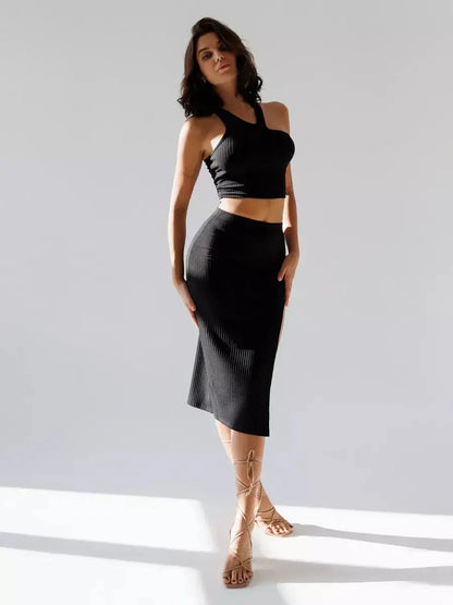 Sculpted Edge Set: Black ribbed knit crop top and high-waisted midi skirt perfect for summer dresses and cocktail occasions.