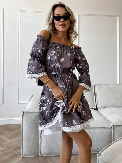 Sakura Flight mini dress featuring off-shoulder neckline, ruffled sleeves, and floral patterns in grey-brown fabric.