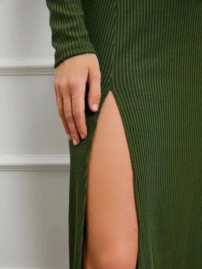 Close-up of side slit on the Verde Muse Midi Dress, showcasing its sleek ribbed knit texture and fitted silhouette.