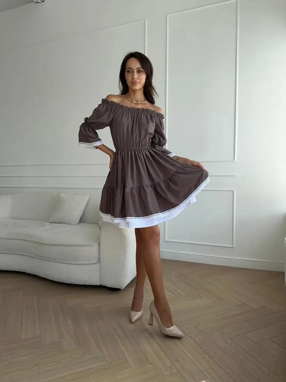 Mocha Muse off-shoulder mini dress with white ruffle trim, perfect for summer weddings and casual outings.