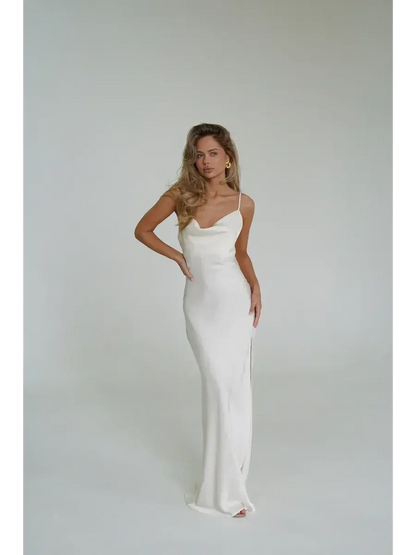 Ivory Luxe Maxi Dress featuring a cowl neckline, side slit, and silky fabric, perfect for summer events and weddings.