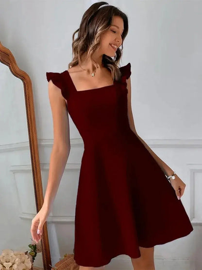 Model wearing a stylish Velvet Rosé red mini dress with flutter sleeves and a square neckline.