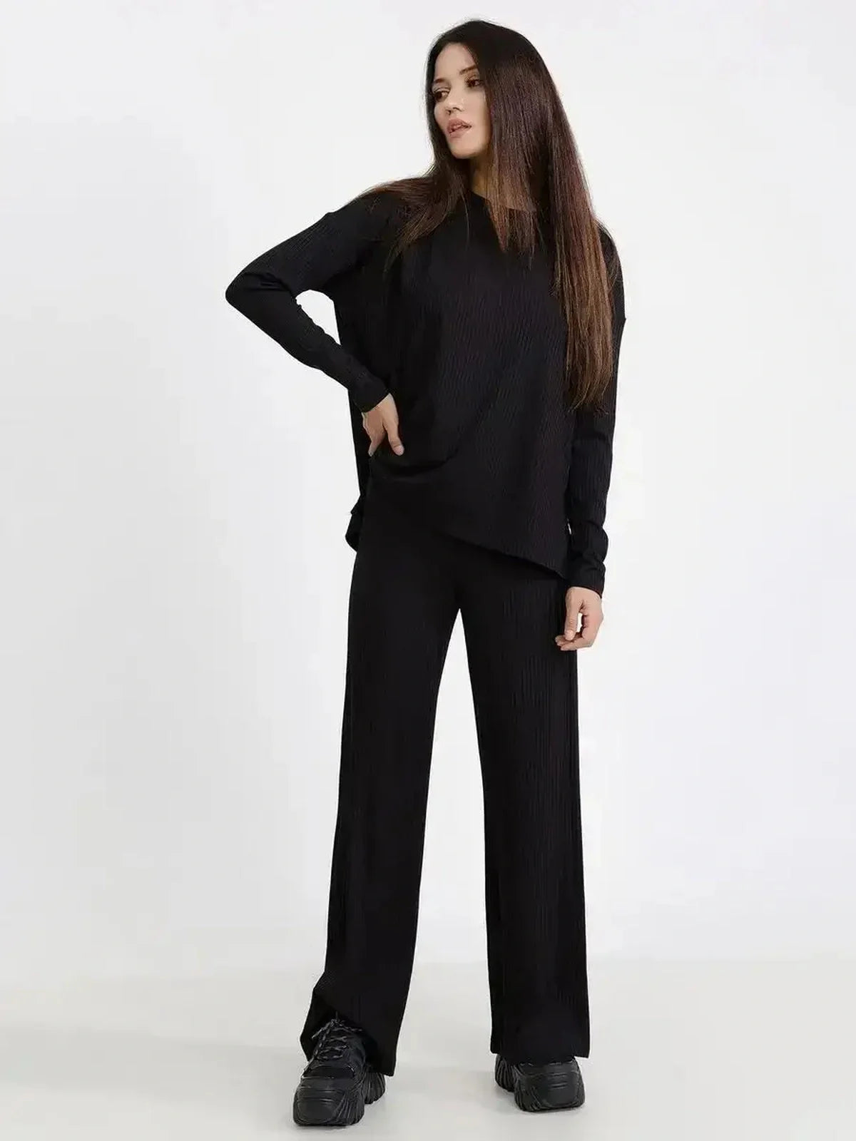 Jet Black Set featuring a relaxed ribbed two-piece with long sleeves and wide-leg pants, ideal for casual chic styling.