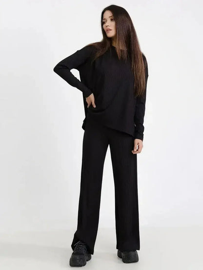 Jet Black Set featuring a relaxed ribbed two-piece with long sleeves and wide-leg pants, ideal for casual chic styling.