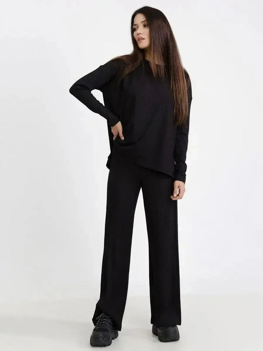 Jet Black Set featuring a relaxed ribbed two-piece with long sleeves and wide-leg pants, ideal for casual chic styling.