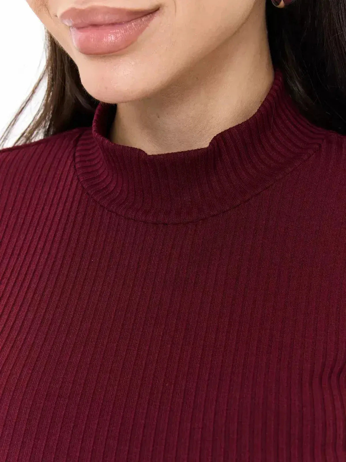 Close-up of a woman wearing a burgundy ribbed knit high neckline from the Velvet Edge Midi Dress.