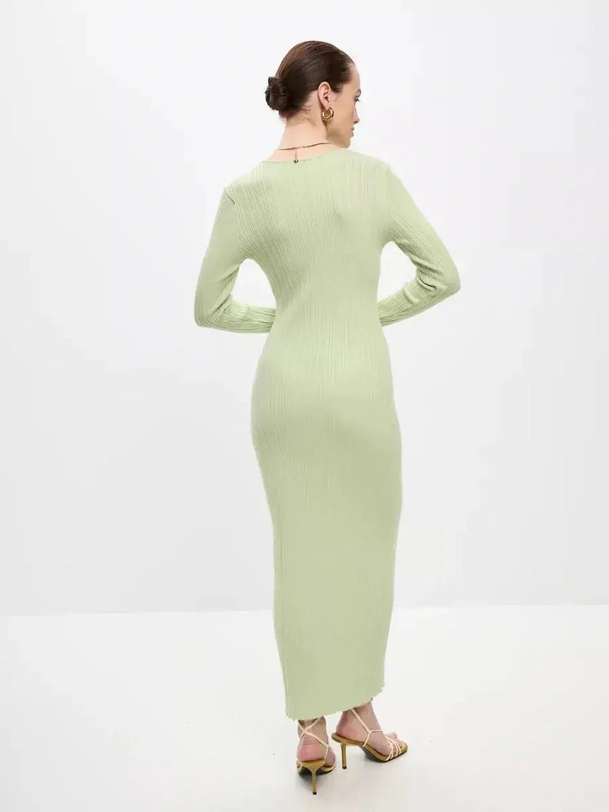 Back view of the Celery Luxe Maxi Dress, a light green ribbed knit dress perfect for summer and formal events.