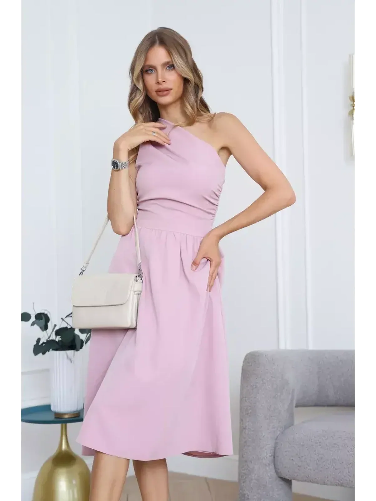 Model wearing a Blush Grace Midi Dress with a one-shoulder design, perfect for weddings and formal occasions.