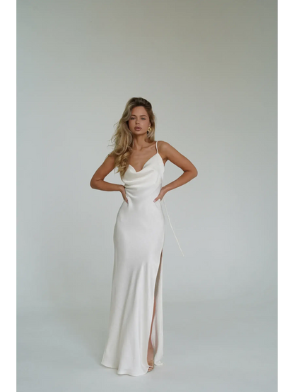 Ivory Luxe Maxi Dress showcasing silky drape, cowl neckline, and high side slit, perfect for summer events and weddings.