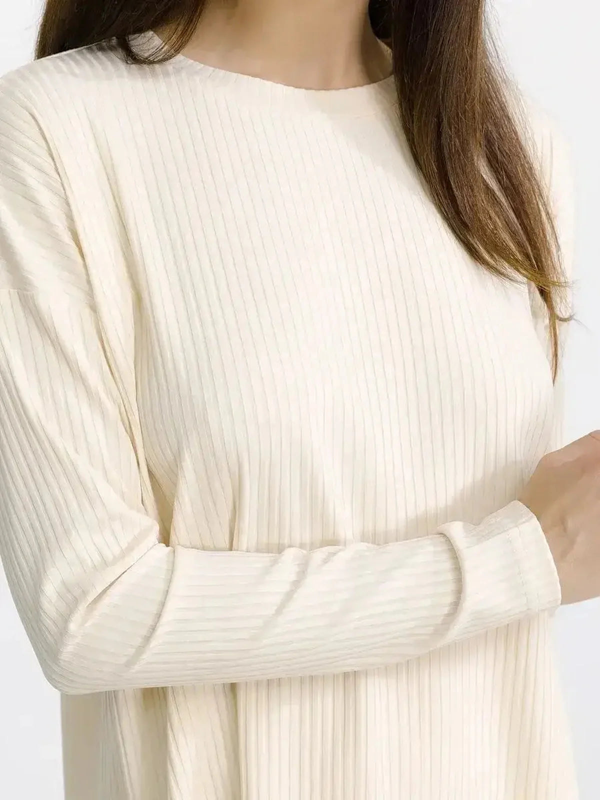 Detail of a soft ribbed oversized lounge top in beige melange, perfect for casual wear or stylish lounging.