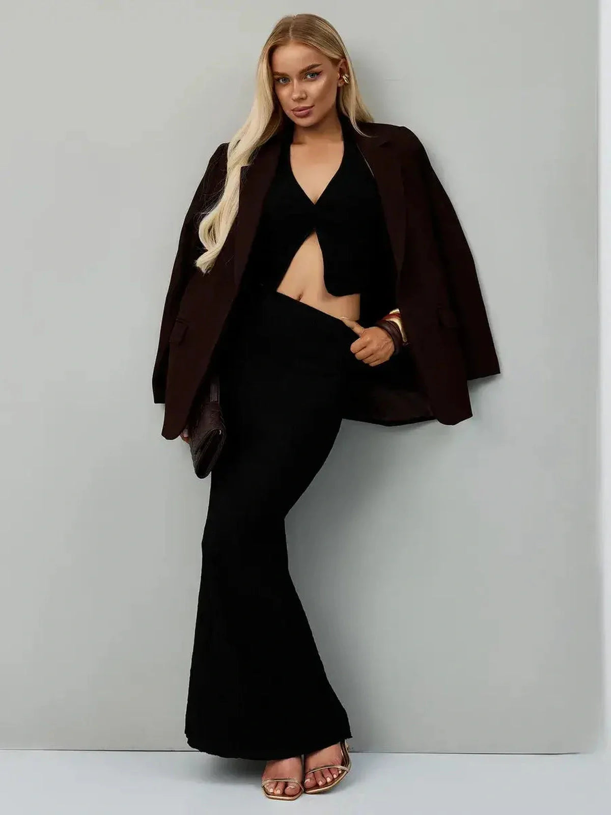 Noir Edge Set featuring a sculpting black halter top and flowing maxi skirt, perfect for formal dresses and evening events.