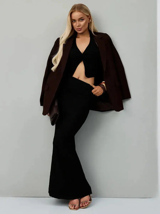 Noir Edge Set featuring a sculpting black halter top and flowing maxi skirt, perfect for formal dresses and evening events.