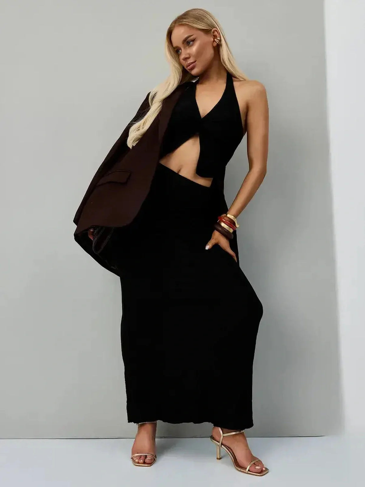 Noir Edge Set featuring a halter top and maxi skirt in jet black, perfect for formal or statement styling.