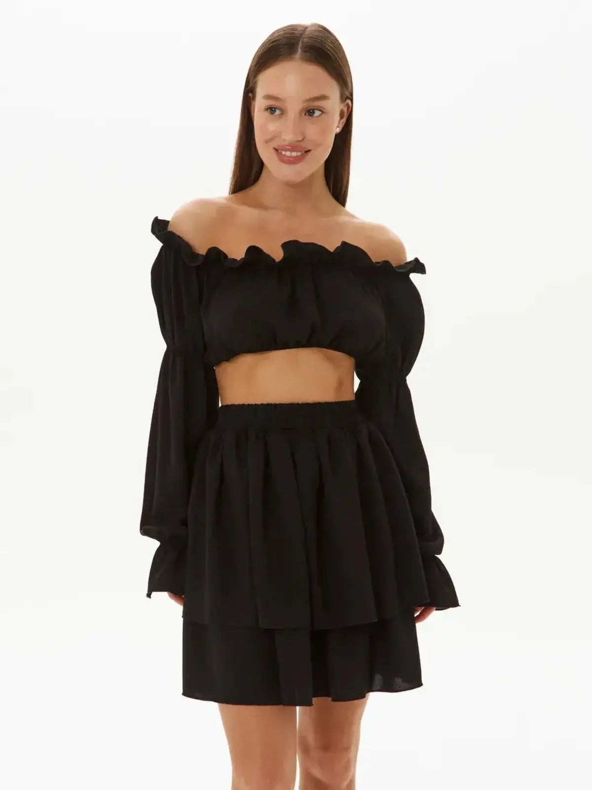 Ruffle Muse Set in black – off-shoulder top and tiered mini skirt, perfect for summer events and casual occasions.