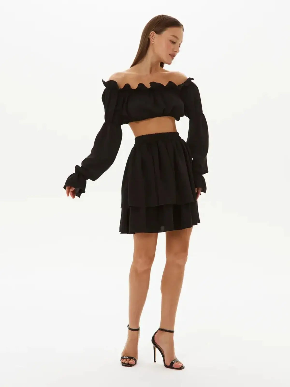 Ruffle Muse Set - Black off-shoulder crop top with tiered mini skirt, perfect for weddings and cocktail parties.