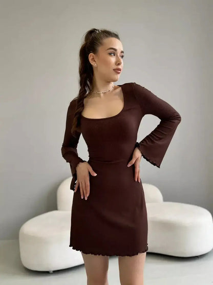 Mocha Muse mini dress featuring long sleeves, scoop neckline, and ribbed texture, perfect for stylish outings and events.