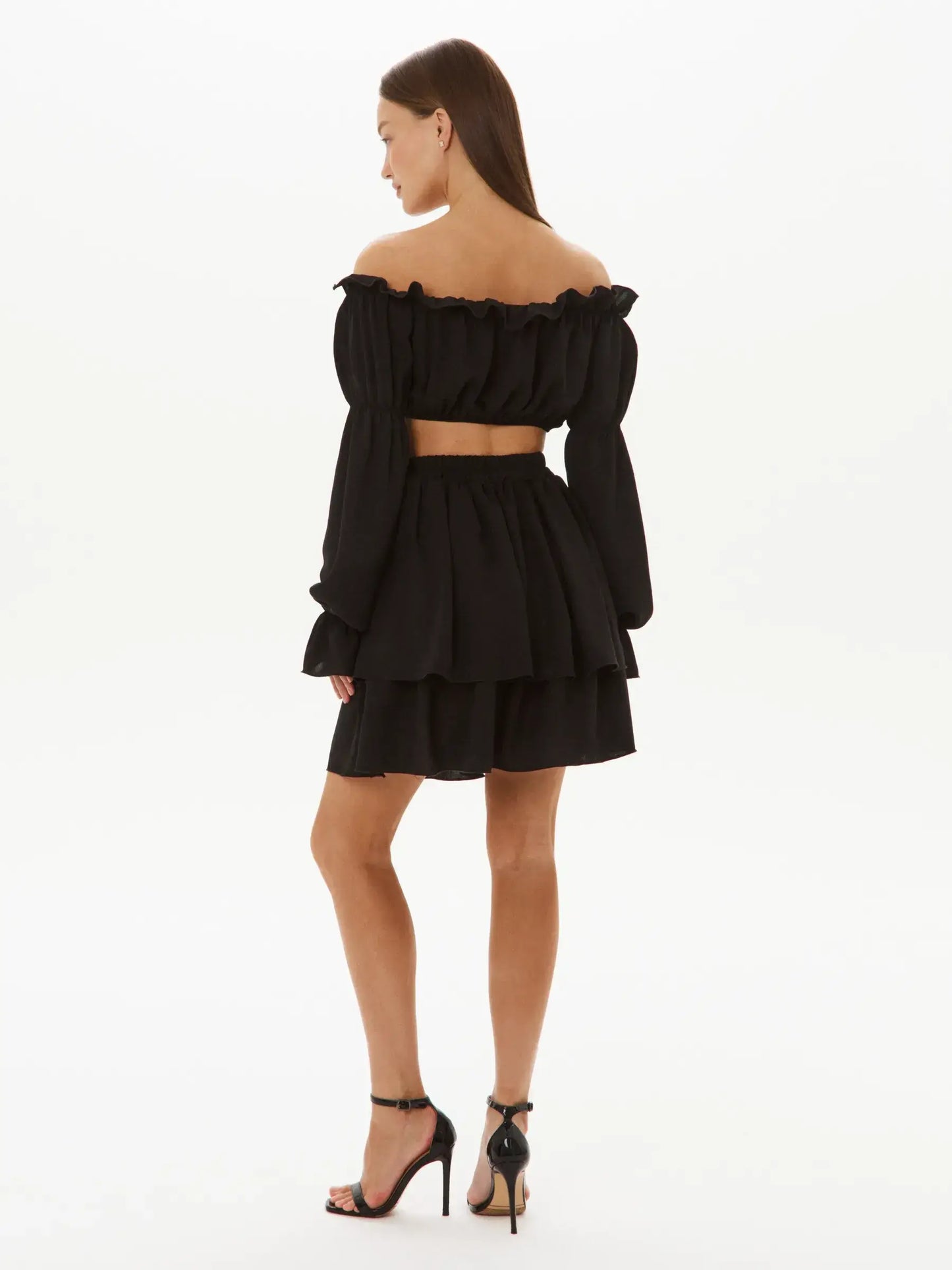 Back view of Ruffle Muse Set – Black off-shoulder top with tiered skirt, exuding modern elegance and effortless style.