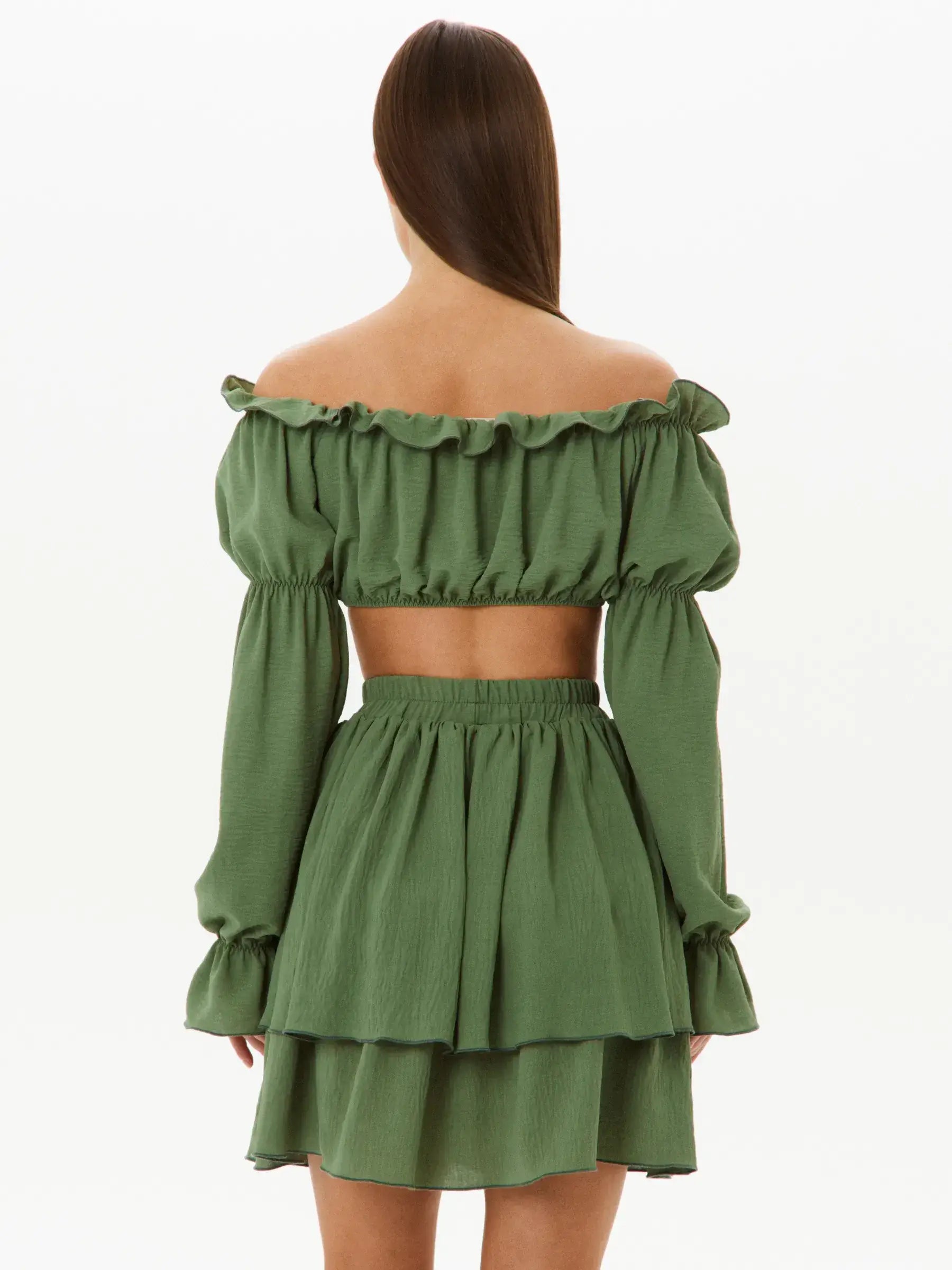Back view of a tiered ruffle set featuring an off-shoulder crop top and a double-tiered mini skirt in khaki.