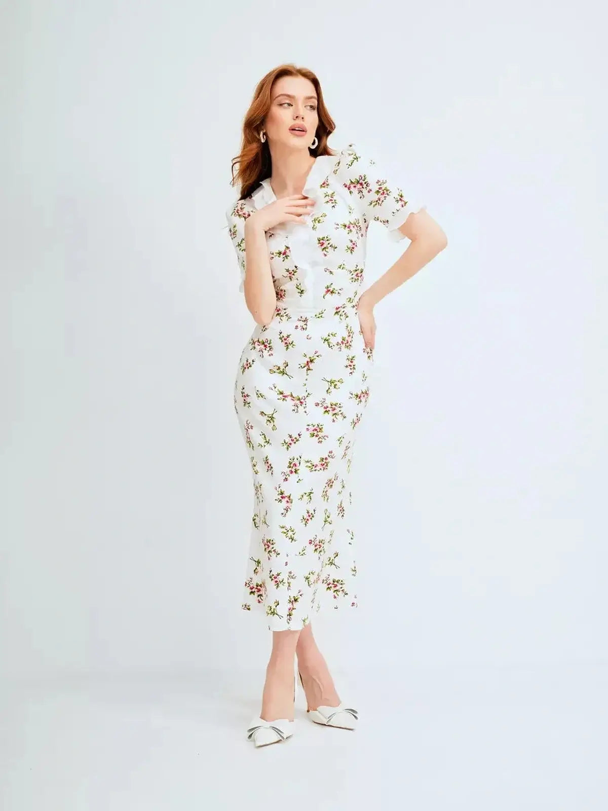 Elegant Roselle Midi Dress with ruffle collar and romantic floral print, perfect for summer occasions and weddings.