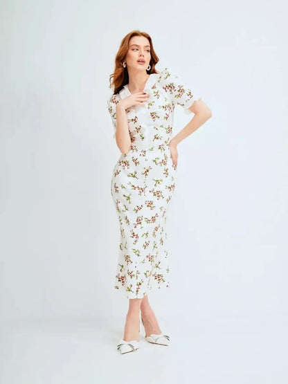 Elegant Roselle Midi Dress with ruffle collar and romantic floral print, perfect for summer occasions and weddings.