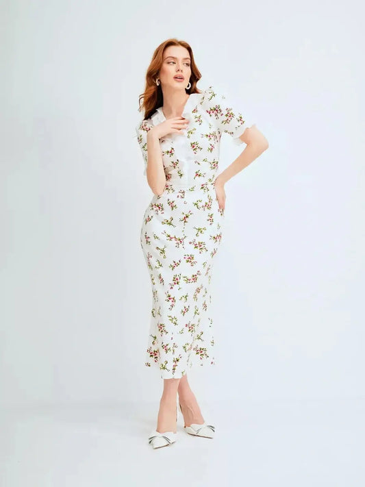 Elegant Roselle Midi Dress with ruffle collar and romantic floral print, perfect for summer occasions and weddings.