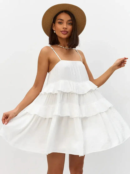 Riviera Ruffle white dress featuring tiered ruffles, perfect for summer, weddings, and casual outings.