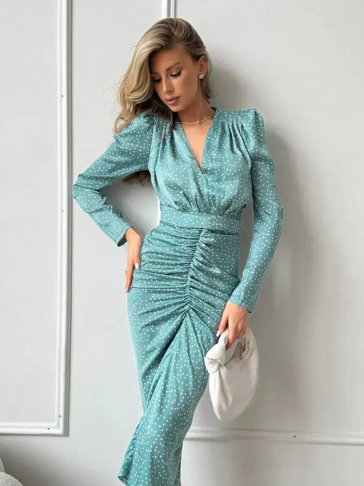Celeste Midi Dress in pastel mint with white polka dots, featuring flattering ruching and long sleeves for stylish women.