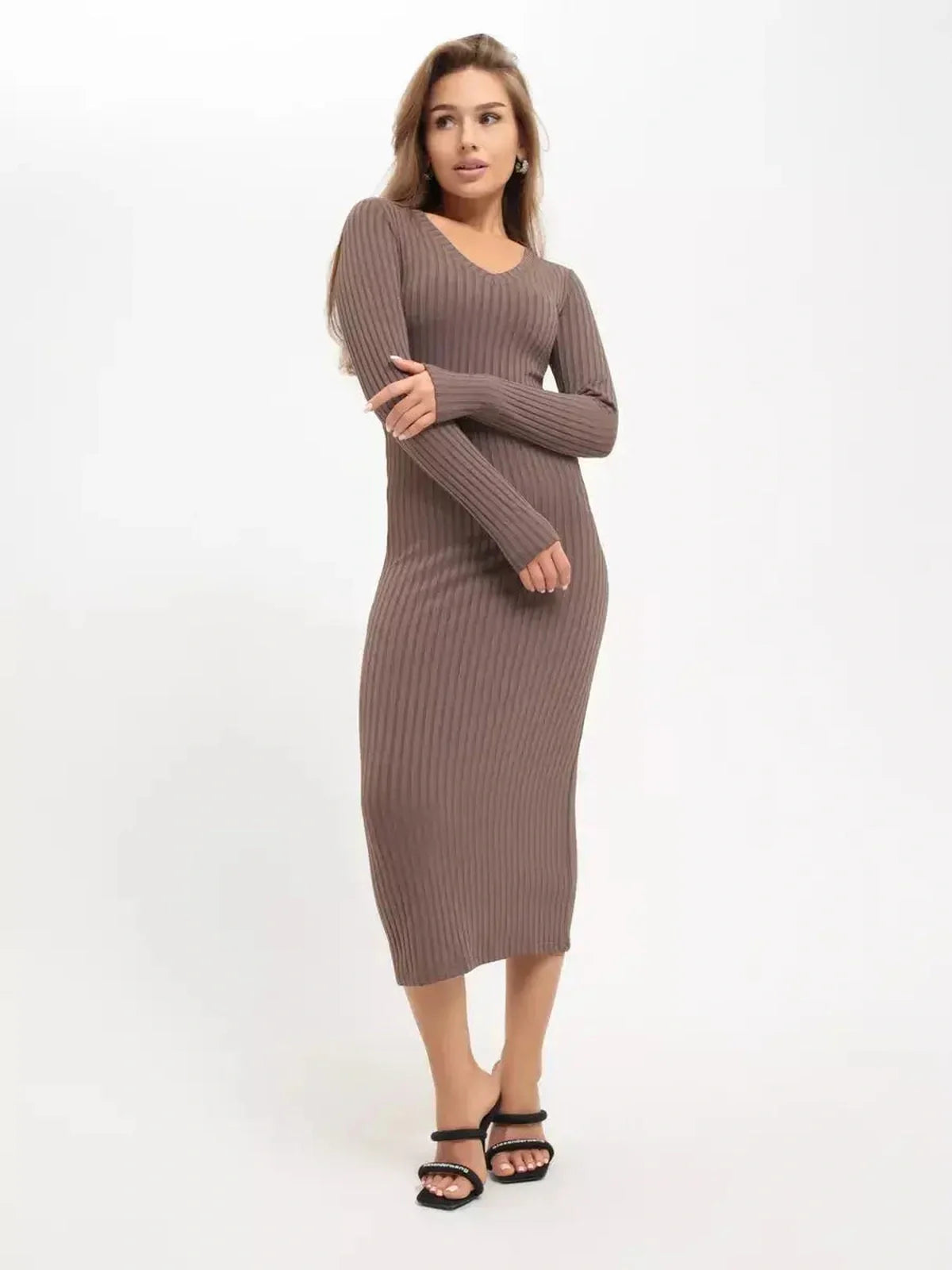 Woman in a sleek ribbed Contour Midi Dress showcasing minimalist elegance, perfect for wedding guest or cocktail occasions.