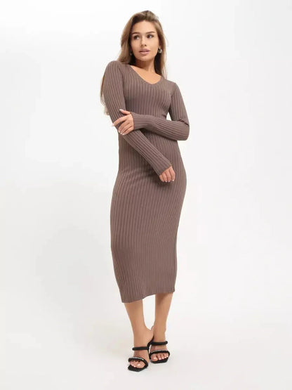 Woman in a sleek ribbed Contour Midi Dress showcasing minimalist elegance, perfect for wedding guest or cocktail occasions.