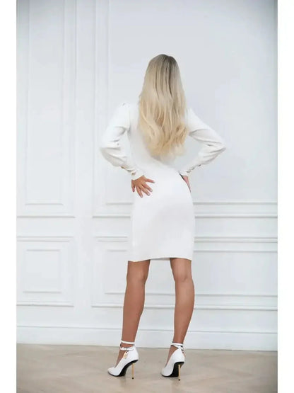 Elegant white mini dress with elegant long sleeves, showcasing a fitted silhouette and chic high heels from the back.