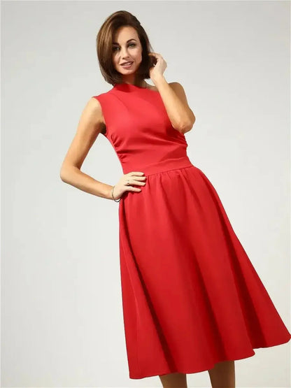 Model showcasing the Scarlet Sway Midi Dress in vibrant red, featuring a one-shoulder design and flared skirt.