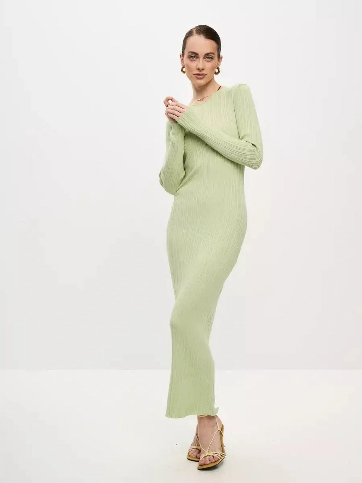 Celery Luxe Maxi Dress in light green ribbed knit, featuring long sleeves and a seamless silhouette, perfect for summer occasions.