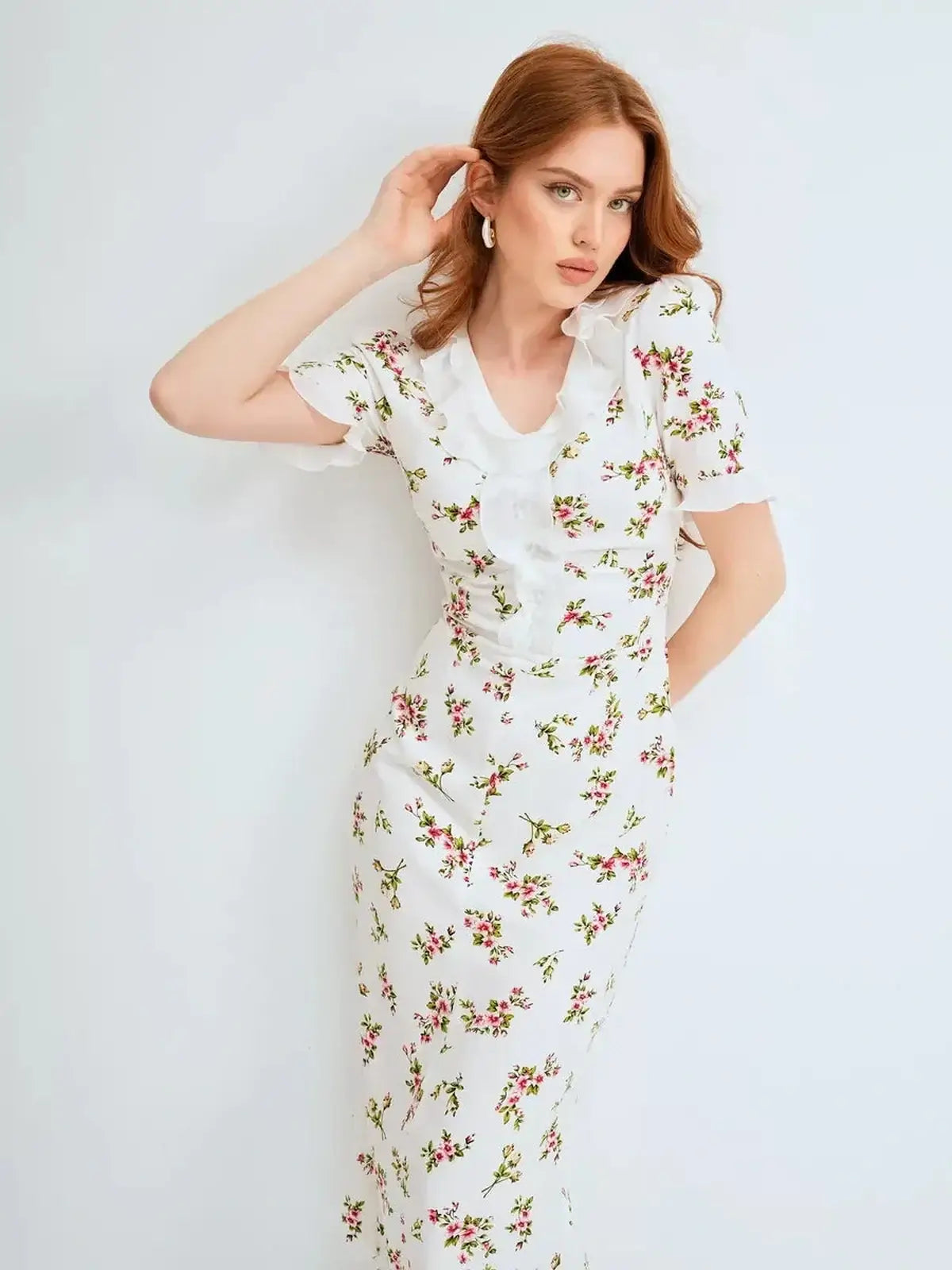 Elegant white floral midi dress featuring a ruffle collar, perfect for summer weddings or formal occasions.