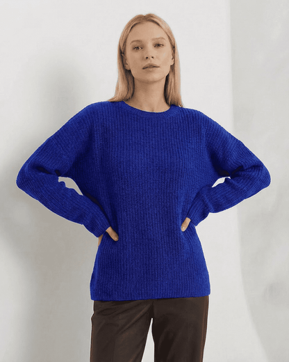 Indira Sweater by Slimona in blue, featuring a loose fit and thick ribbed knit design, perfect for cooler months.