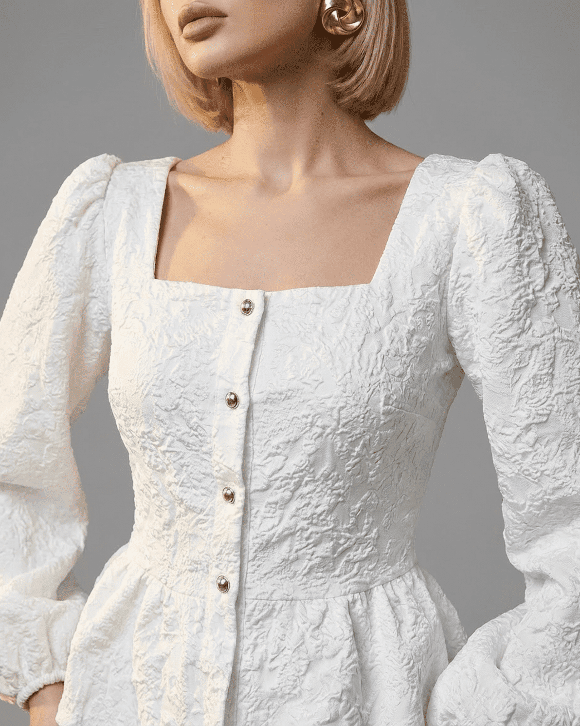 Ivory Corset Top by Slimona featuring square neckline, puff sleeves, and structured jacquard fabric in white.