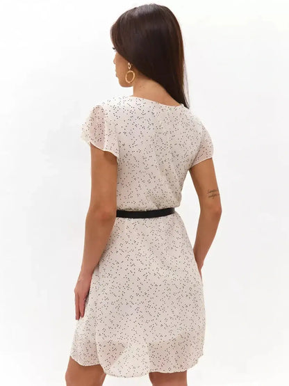 Ivory glimmer mini dress with polka dots and flutter sleeves, perfect for summer weddings and casual occasions.