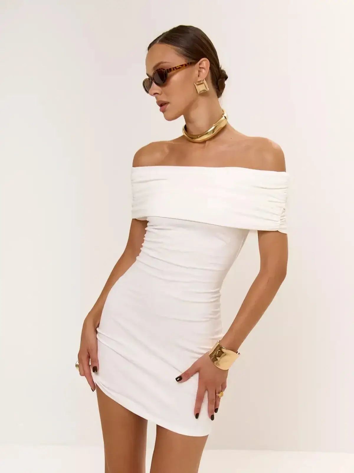 Ivory Sculpt off-shoulder mini dress featuring a ruched silhouette, perfect for wedding guests and summer parties.