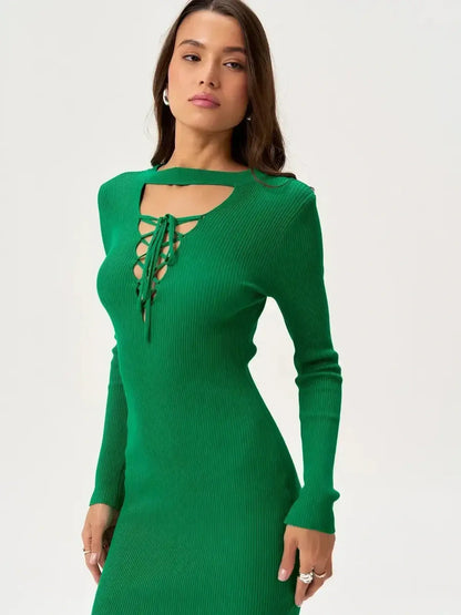 Sleek green mini dress with lace-up detail and long sleeves, perfect for summer dresses and cocktail events.