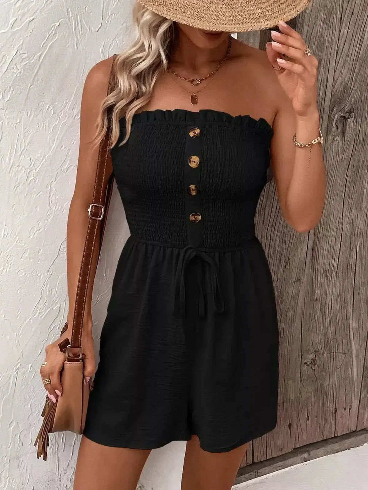 Chic black Jet Noir Mini Dress with strapless design, smocked bodice, and flared shorts, perfect for summer and parties.