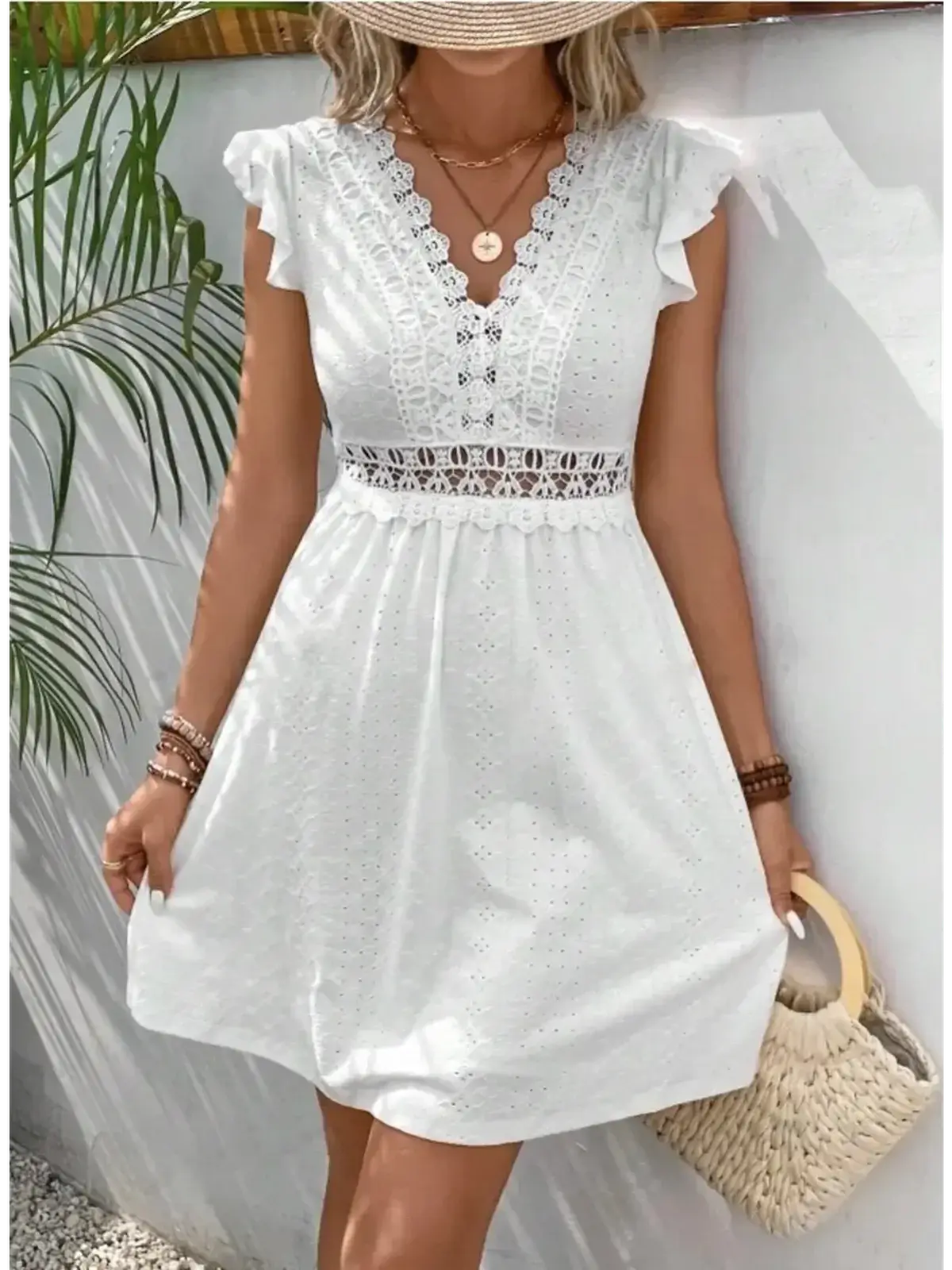Lace Halo Mini Dress in white with flutter sleeves and intricate lace detailing, perfect for summer occasions.