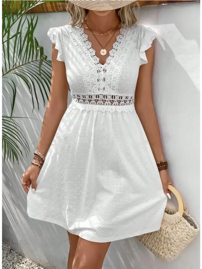Lace Halo Mini Dress in white with flutter sleeves and intricate lace detailing, perfect for summer occasions.