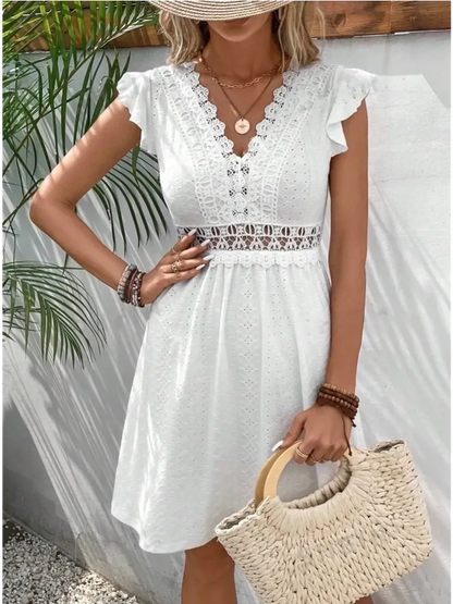 Lace Halo Mini Dress in white with flutter sleeves and lace trim, perfect for summer or wedding guest attire.