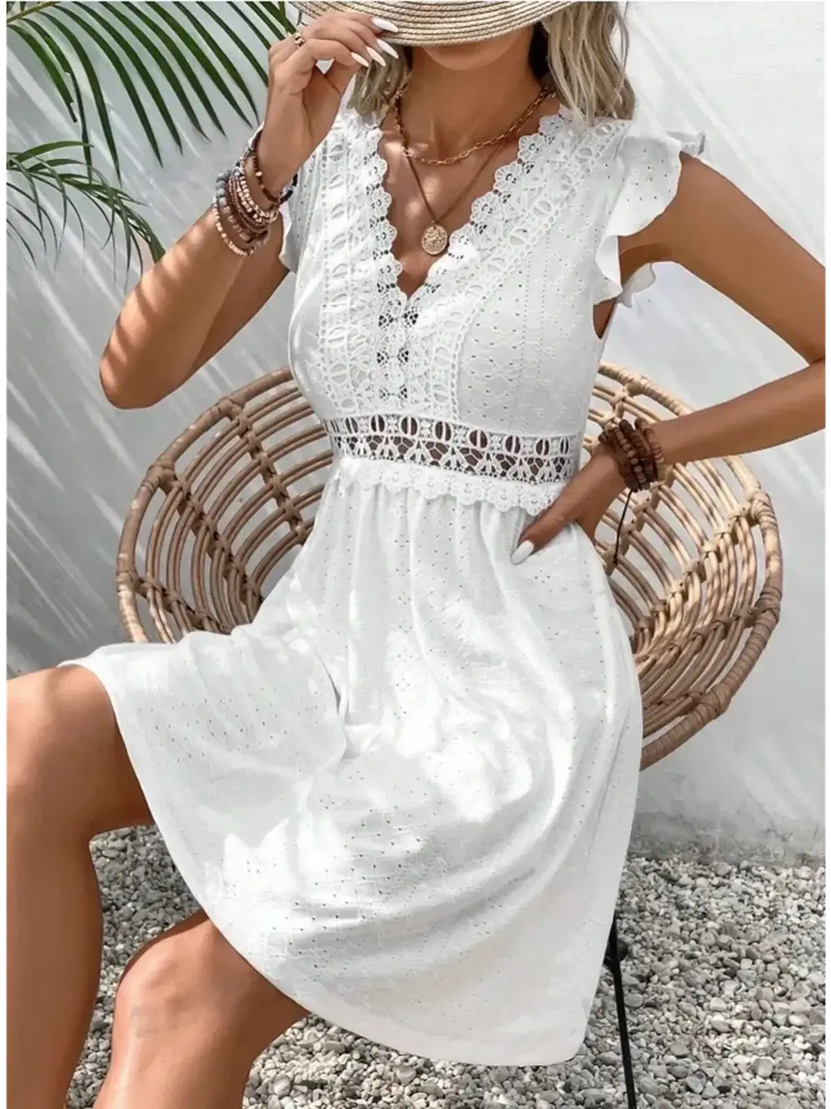 Elegant white lace halo mini dress with flutter sleeves, perfect for summer, weddings, and special occasions.