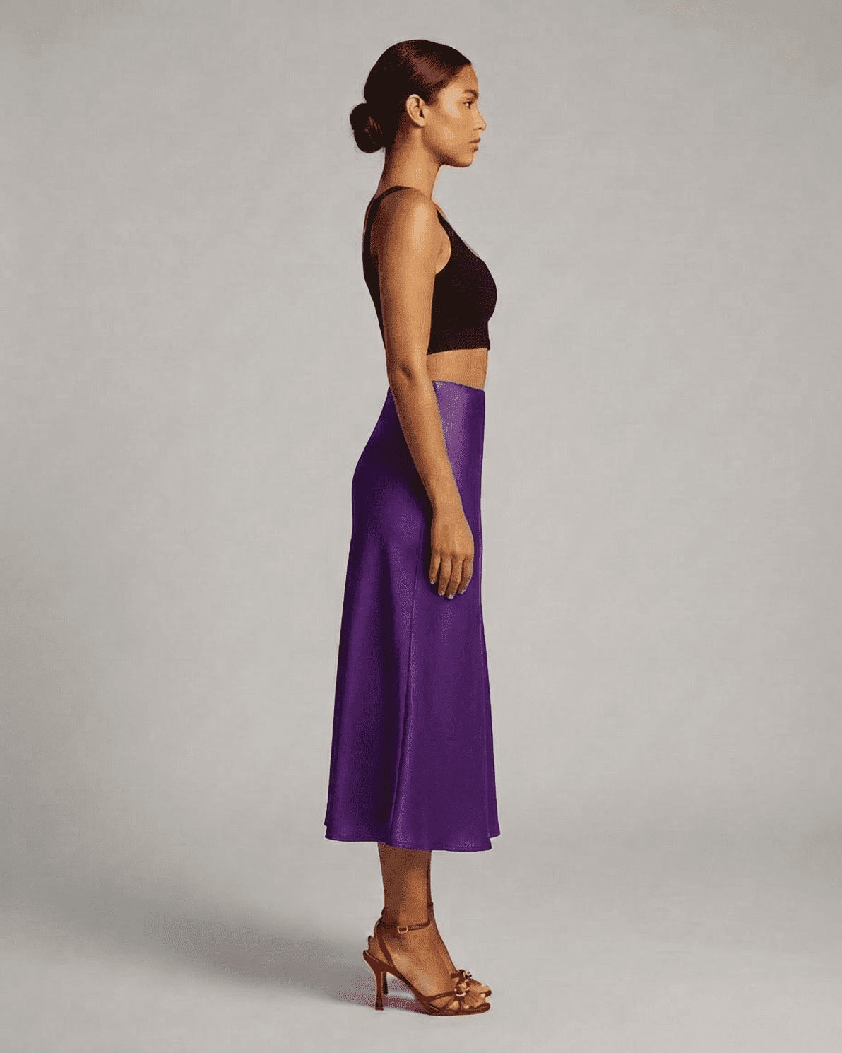 Amethyst Midi Skirt by Slimona showcased on a model, highlighting its elegant silhouette and rich purple color.