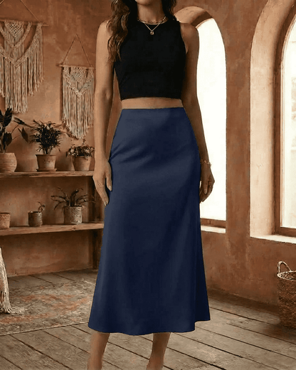 Astra Midi Skirt by Slimona in deep navy blue, satin mermaid style, showcasing smooth elegance and modern design.