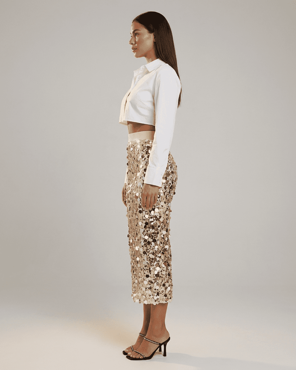 Aureline Midi Skirt by Slimona: Sequin high waist bodycon midi skirt showcased on model in profile view.
