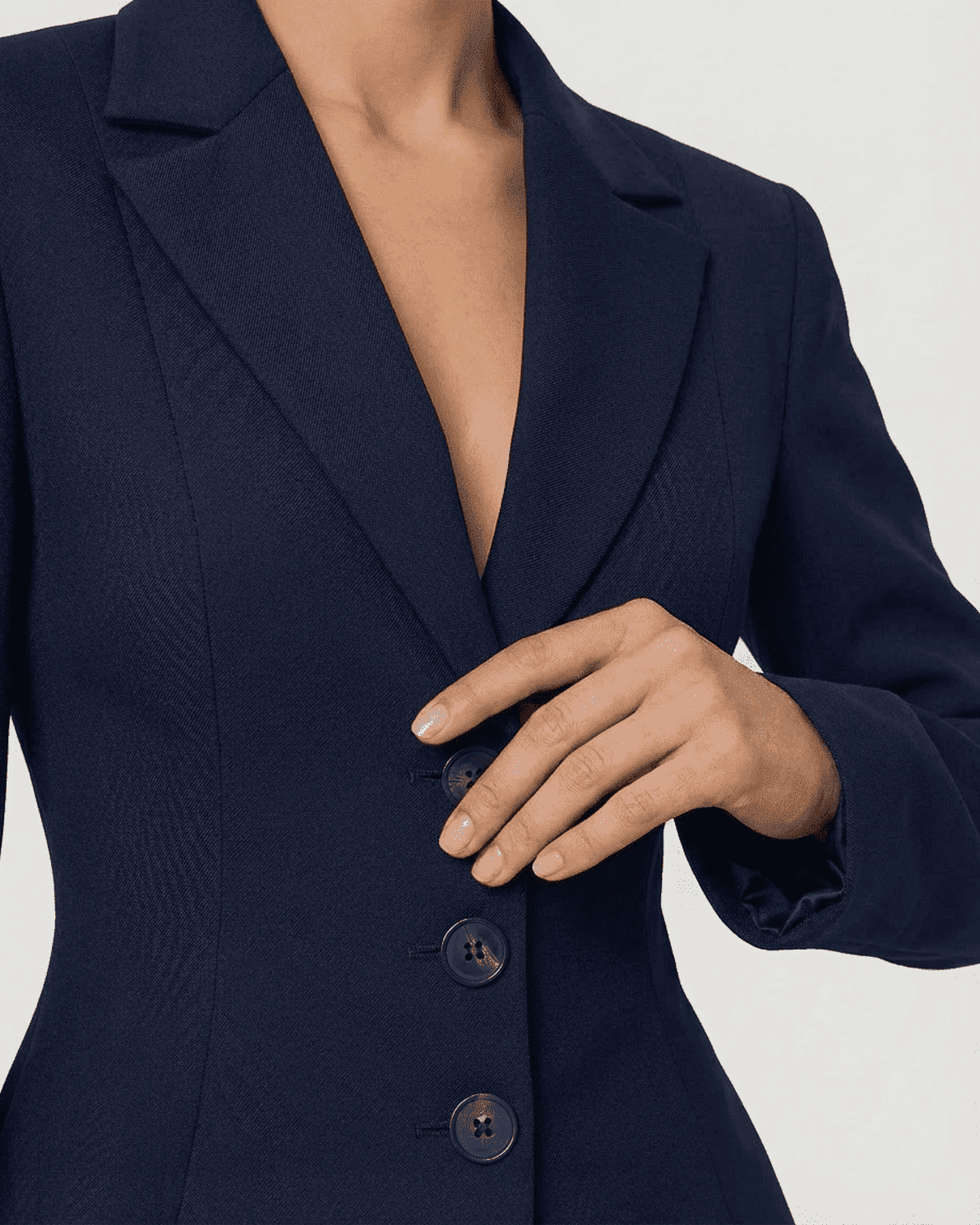 Aurora Blazer by Slimona, showcasing a fitted waist, V-neckline, and stylish button detail in navy.
